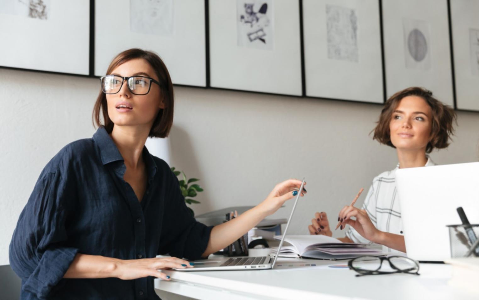 Student working on budget planning project with detailed financial spreadsheets